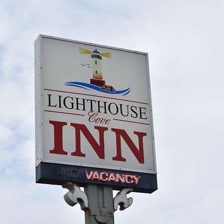 Lighthouse Cove Inn Бандон Экстерьер фото The sign for the Lighthouse Inn